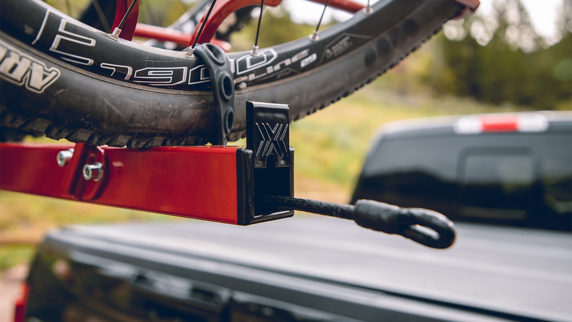 Bike rack top bar with integrated locking system coming out.