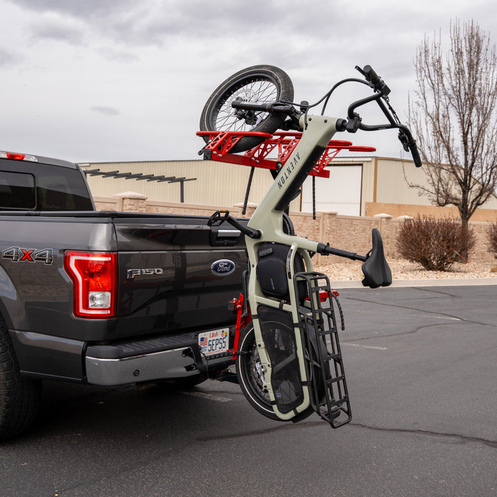 Truck carrying long cargo ebike with wheelbase adaptor
